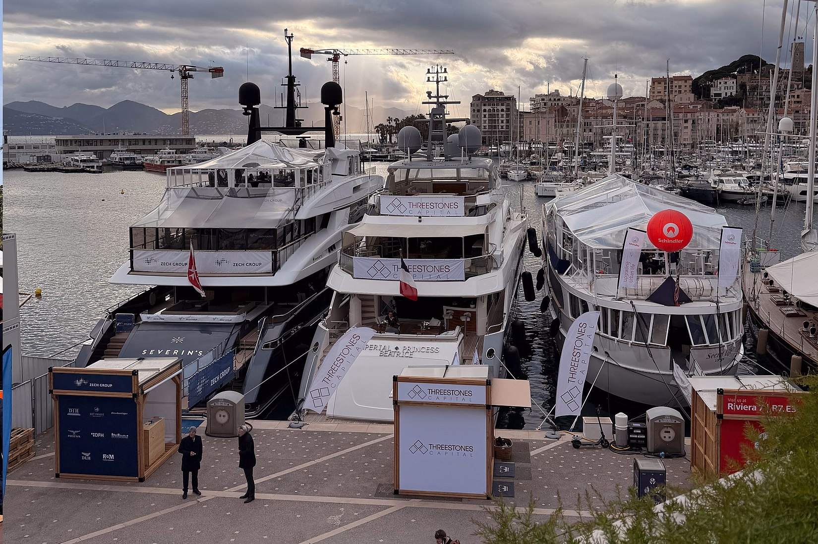 MIPIM 2026 waterfront in Cannes with real estate developer pavilions and branded yachts